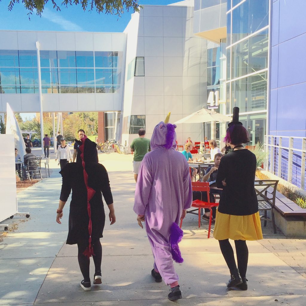 Part of my team dressed up for Halloween: me a dragon, my co-worker a unicorn and triangle of chaos that has taken over another person